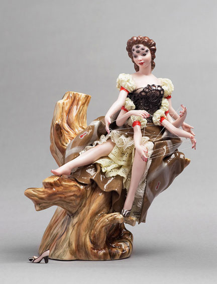 A porcelain figurine of a woman with eight spider-like limbs, by Shary Boyle.