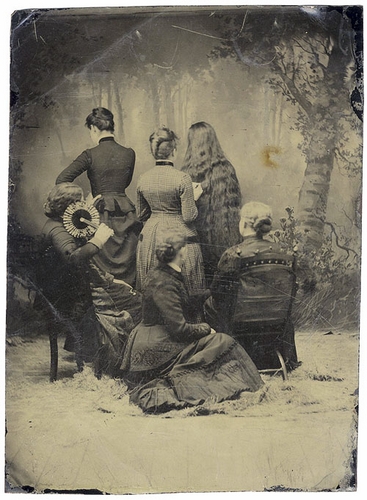 Group of Victorian women facing backward.