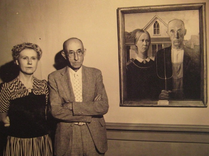 The models of American Gothic pose with Grant Wood's iconic painting.