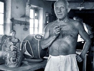 Pablo Picasso shirtless.