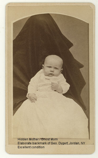 Victorian photograph of a child with mother disguised in the background.