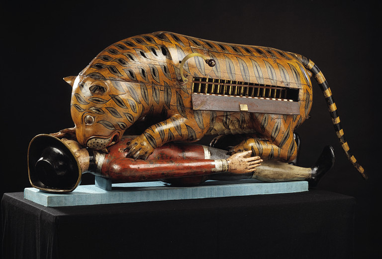 Life size 18th century automaton of tiger eating European man from the Victoria and Albert Museum