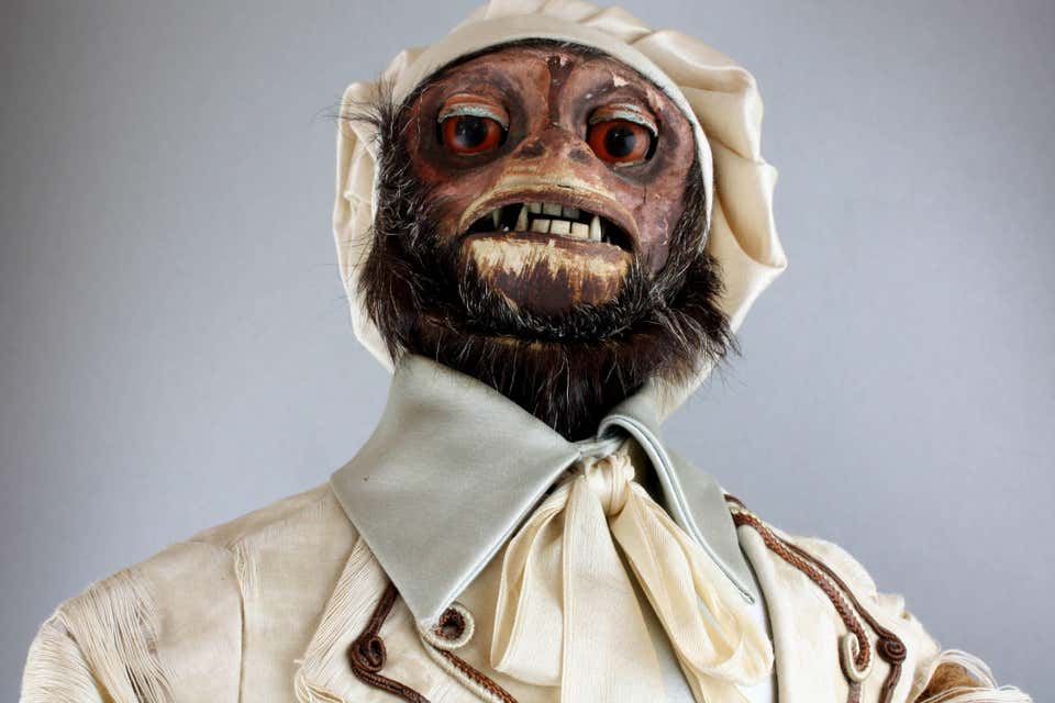 Close view of the face of a 19th century monkey automaton